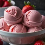 Quick no-churn strawberry ice cream recipe using frozen berries.